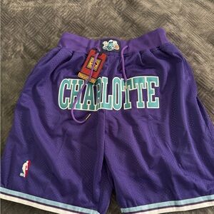 Purple Athletic Basketball Shorts with Charlotte Hornets Design